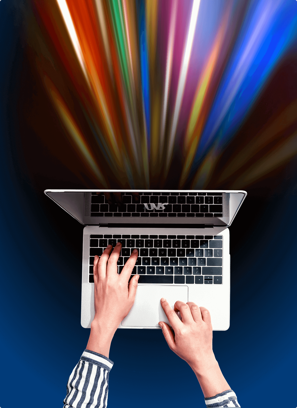A pair of hands typing on a laptop with an array of rainbow-colored lights coming from the computer, symbolizing the fastest speeds with Usenet that are available through UsenetServer.
