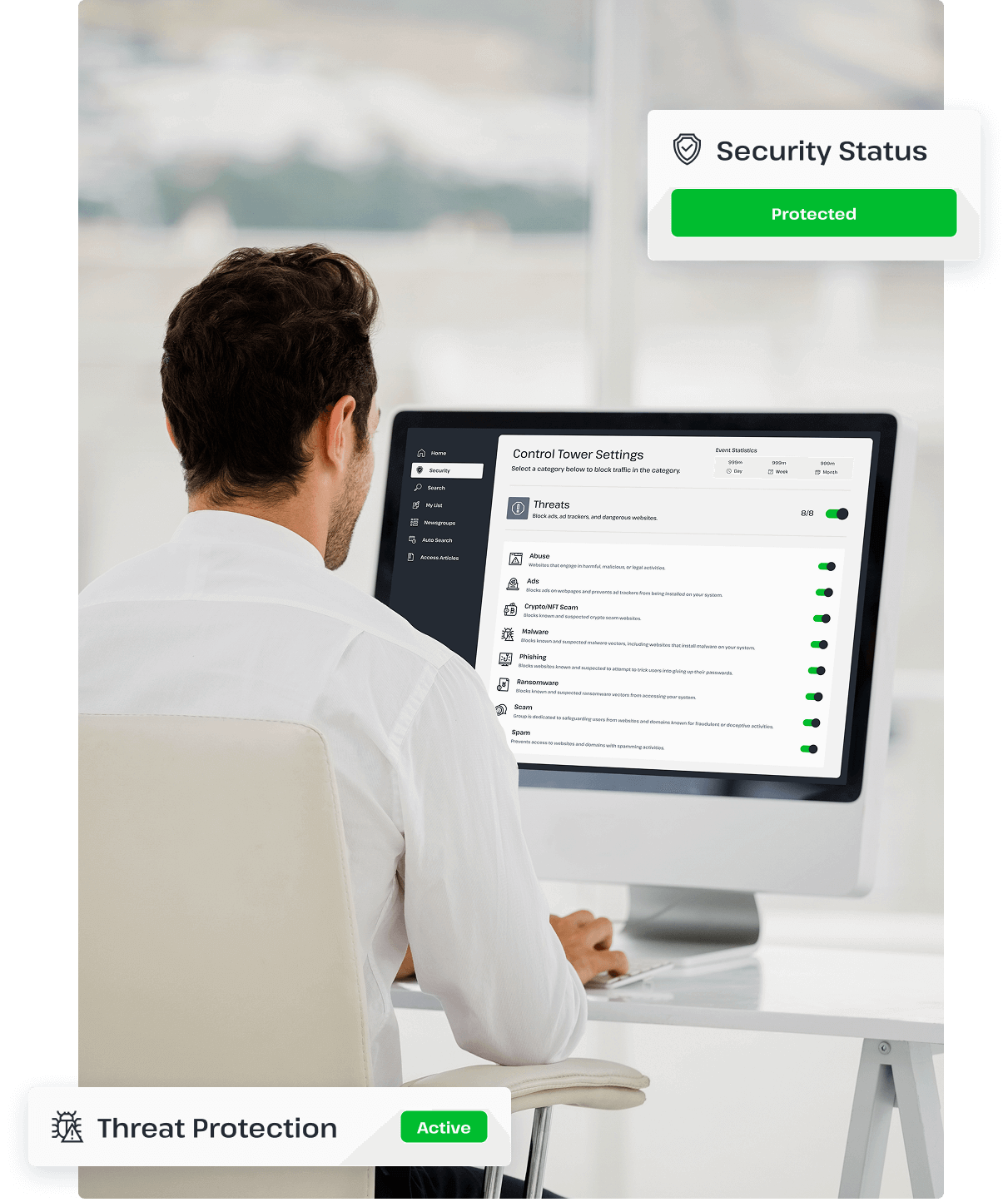 A man is using a desktop computer connected to UsenetServer’s premium VPN, showing that he is using the threat protection tool to protect his online browsing.