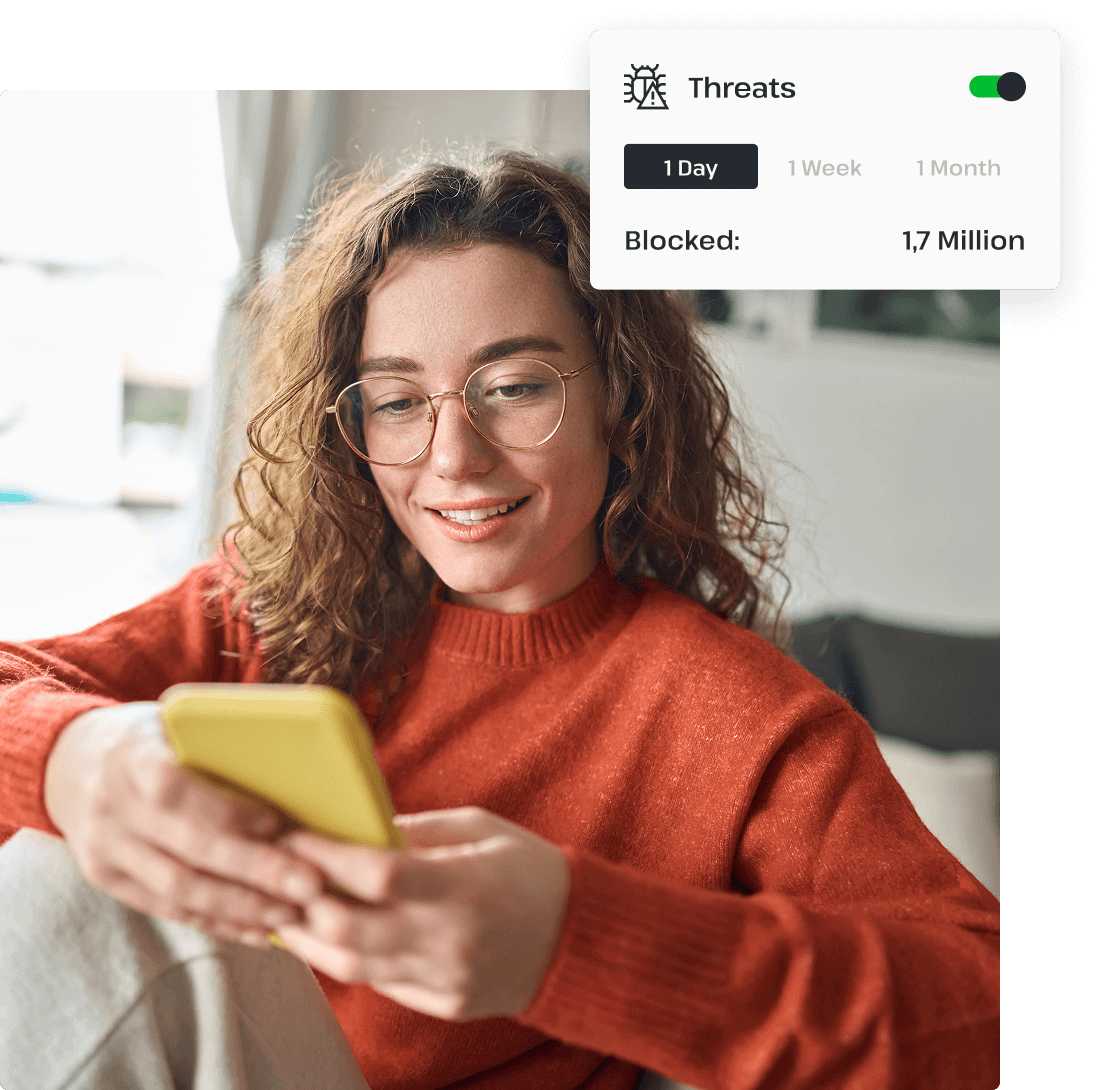 A woman in glasses uses UsenetServer’s VPN on her mobile phone to protect herself against threats on her smartphone.