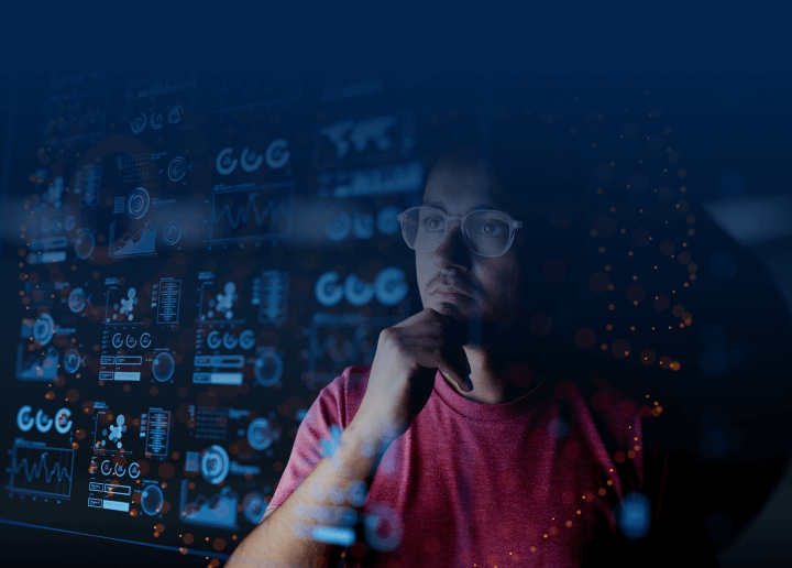 A man wearing glasses examines secure DNS metrics, showing that UsenetServer offers the most secure and dependable DNS functionality of any Usenet provider.