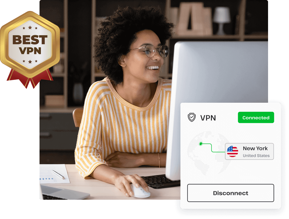 A woman smiles while browsing on her desktop computer, thanks to the security of the UsenetServer VPN for Usenet.